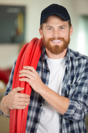 happy plumber smiling at the cameraの写真素材