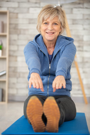 active senior woman warming up