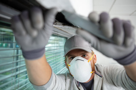 worker wearing dust-mask for construction repairjobの写真素材