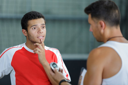 coach and play of football talking indoorの写真素材