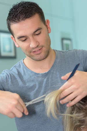 scissors cut the girls hairの写真素材