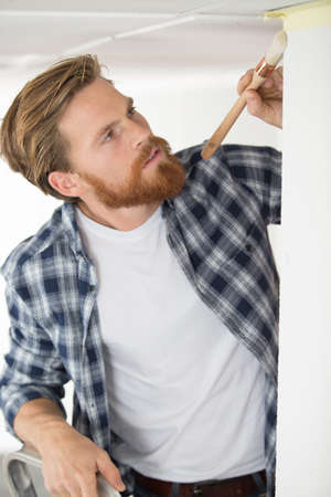 painter working with paint brushの写真素材