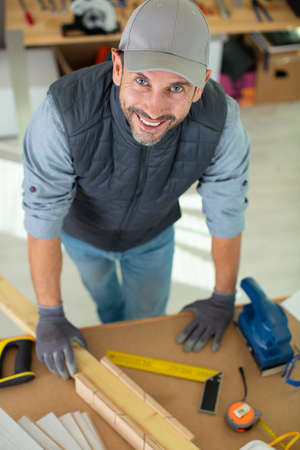 image of mature carpenter in the workshopの写真素材