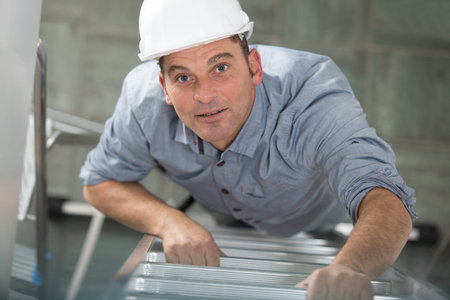 top view of man climbing on ladder