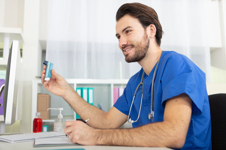 young doctor working with computer