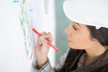 a female architect amending plansの写真素材