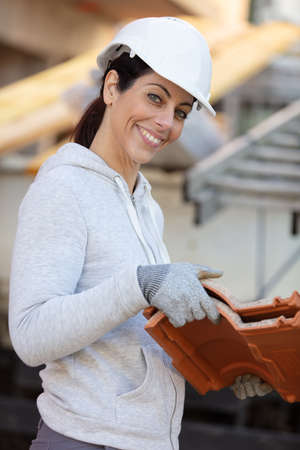 female builder at work on siteの写真素材