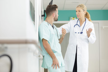 medical staff having discussion in a hospital hallway
