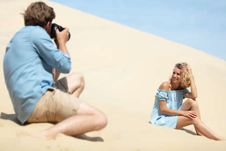 happy young couple spending fun time at the beachの写真素材