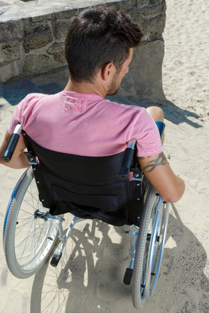 disabled man on wheelchair having trouble with stairs