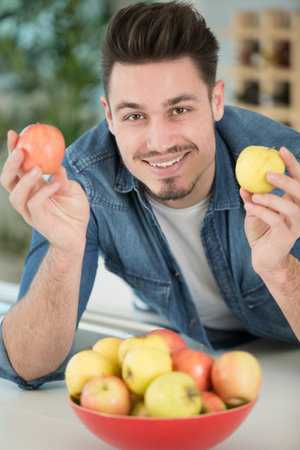happy man with applesの写真素材