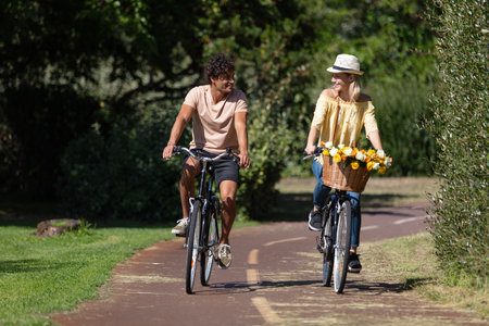 people in love riding together on the same bicycleの写真素材