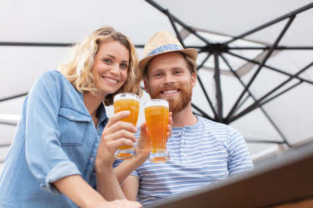 couple in love having a beerの写真素材