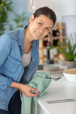 young woman in kitchen during quarantineの写真素材