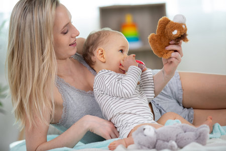 mother plaing with her daughter baby