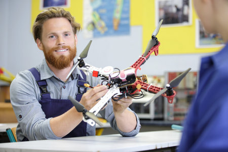 a man is fixing a drone