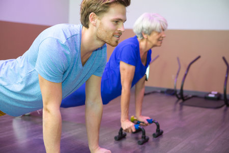 senior woman doing push up for therapy