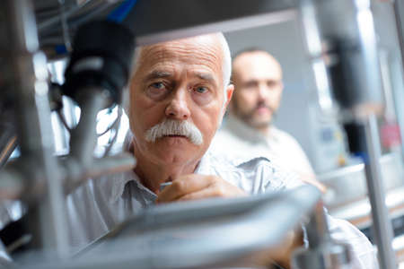 senior in working in logistics warehouse storeの写真素材