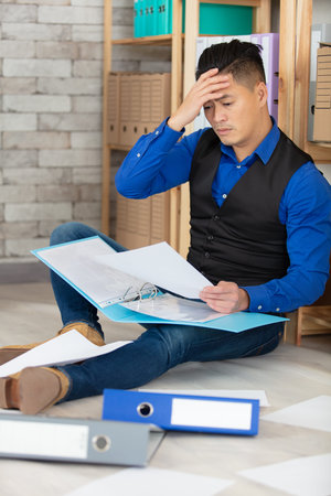 frustrated overwhelmed executive working in the office