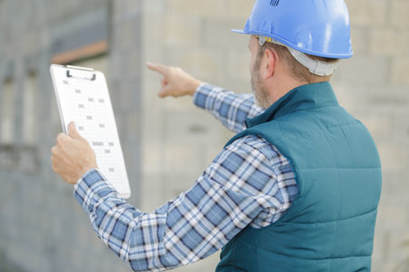 site manager pointing on place of future building