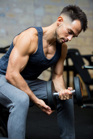 fitness man with dumbbell in gym