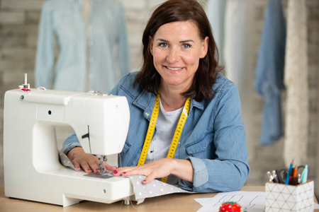 happy woman and sewing workshop