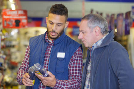 portrait of two warehouse workers discussingの写真素材