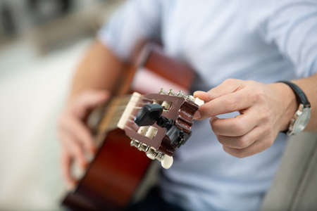 close-up image of musician tuning guitarの写真素材