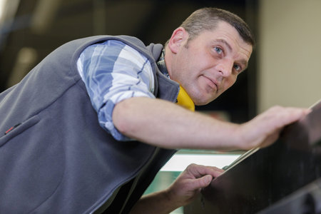 service man worker in workshop machine