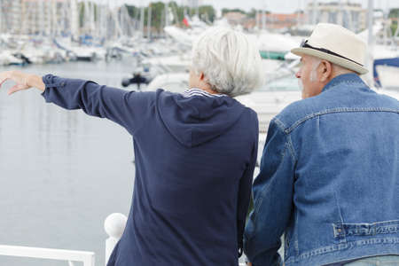 a senior couple pointing at somethingの写真素材