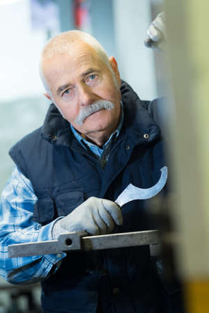 senior mechanic works at the latheの写真素材