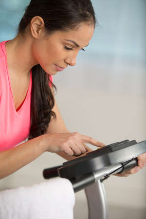 woman is exercising on step machineの写真素材