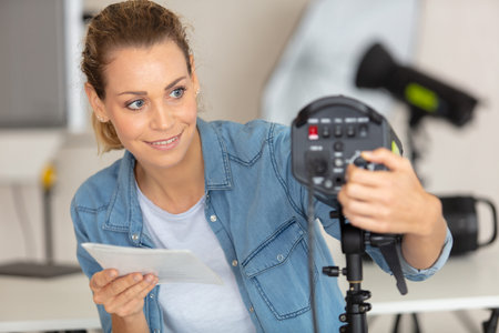 young female photographer posing in the photo studio