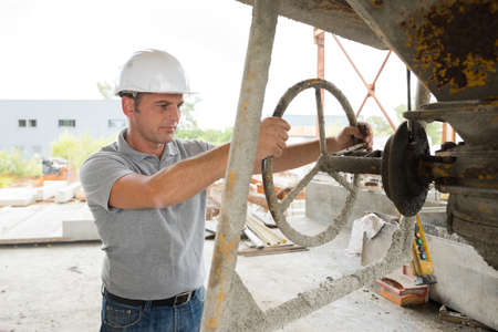 industrial factory worker turning valveの写真素材