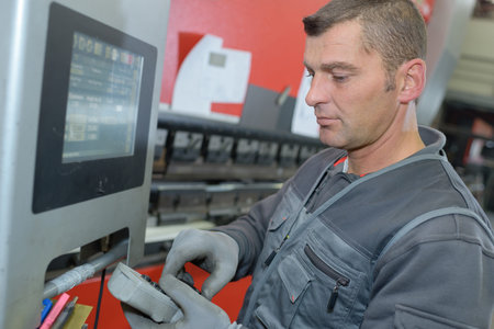 a man setting the machine program