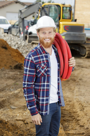 happy plumber repairs the pipes erage