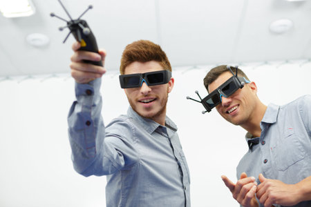 two men experiencing virtual reality glasses
