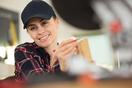 happy hardworking focused professional carpenter woman