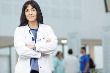 portrait of female doctor with crossed arms