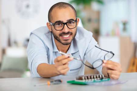 engineer fixing broken computer motherboardの写真素材