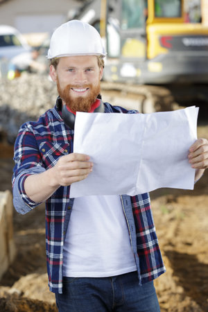 civil engineer is examining blueprint