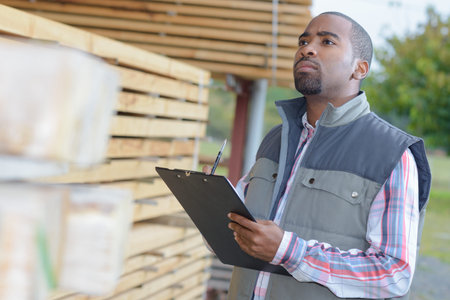 portrait of industrial worker with clipboardの写真素材