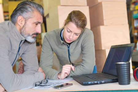 logistics employees checking the informationの写真素材