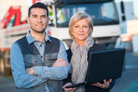 manager and delivery worker posign