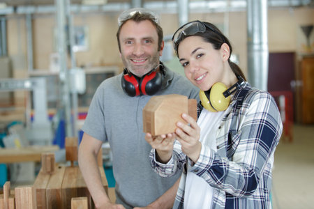 man and woman in wood workshop