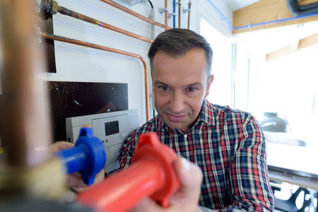 factory worker in charge of plumbing control