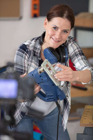 woman is doing a diy vlogの写真素材