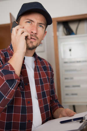 engineer or technician man on the phoneの写真素材