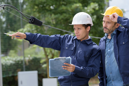 they are working on electrical lineの写真素材
