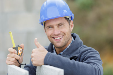 happy builder showing thumb up